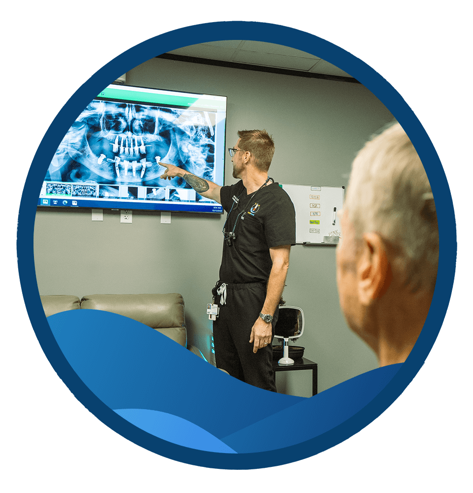 Dr. Justin Seaman pointing at a patient's x-ray