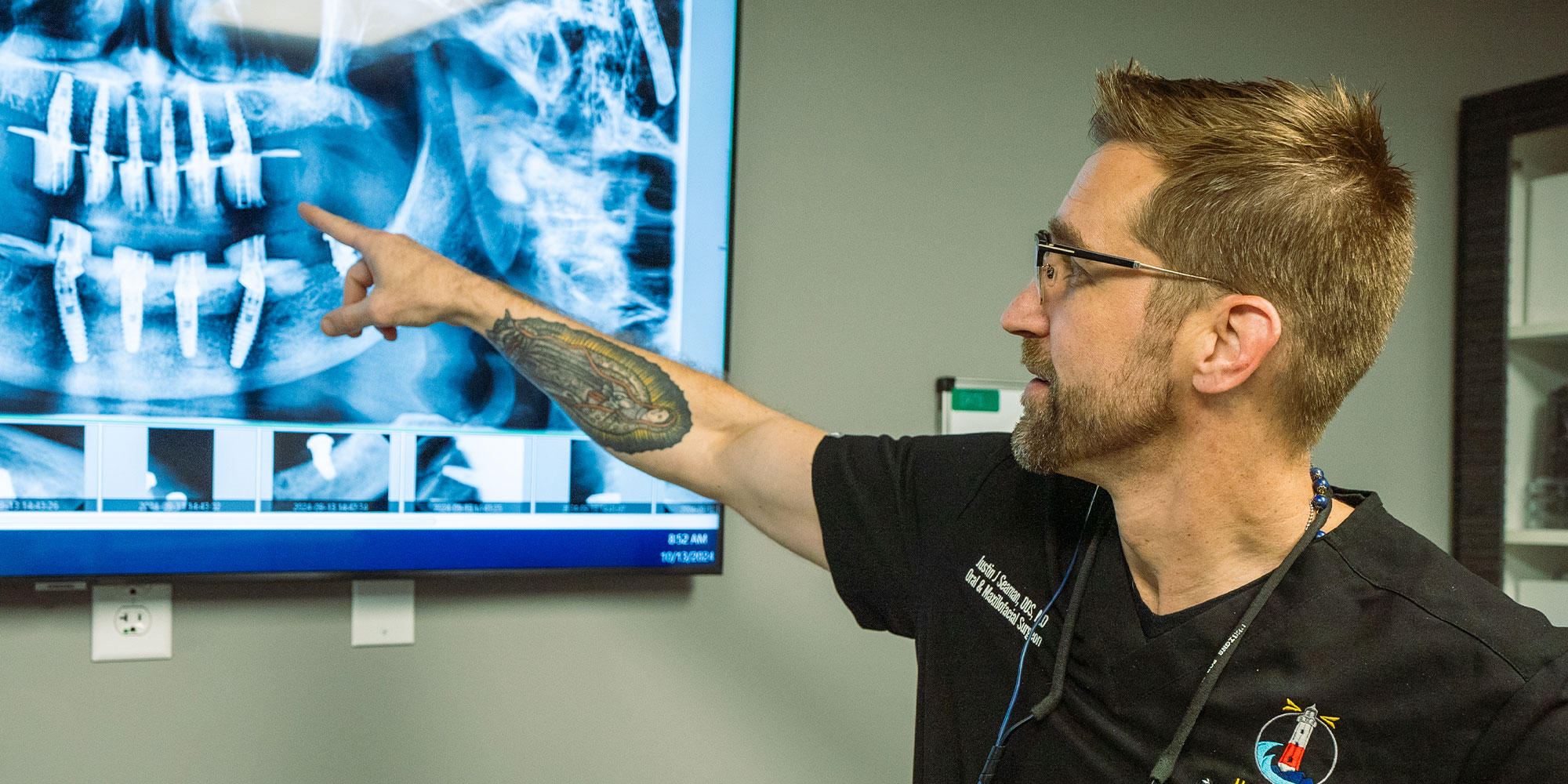 Dr. Justin Seaman pointing at a patient's x-ray