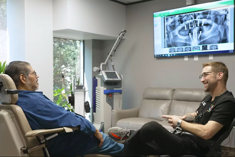 Dr. Justin Seaman. consulting with a patient
