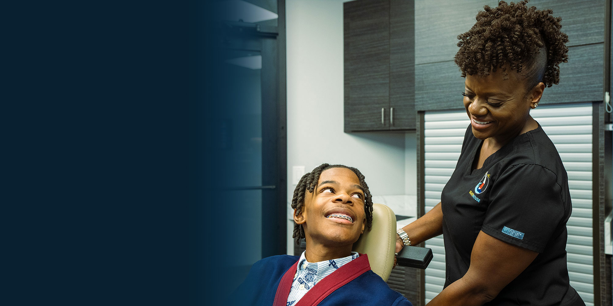 patient and staff member going over dental procedure information before treatment